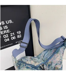 Detail of adjustable wide shoulder strap and smooth double zipper on floral jacquard tote bag