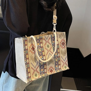 Ethnic bohemian woven tote bag with geometric patterns and adjustable shoulder strap