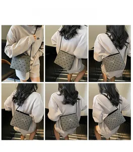 Polka dot canvas shoulder bag with silver bow accent shown on model in various angles