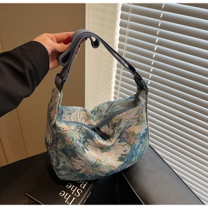 Close-up of artistic oil painting floral pattern and texture on the canvas tote bag