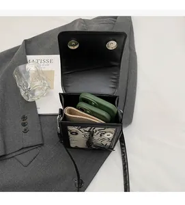 Internal view of fashion crossbody bag showing capacity for phone and wallet