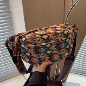 Retro ethnic crossbody bag featuring colorful geometric woven patterns and brown wide strap