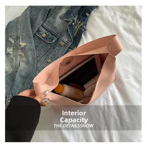 Spacious interior of pink tote bag showing room for tablet and daily cosmetics