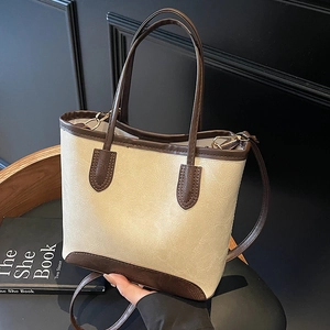 Minimalist beige and brown color-block tote bag with top handles and shoulder strap