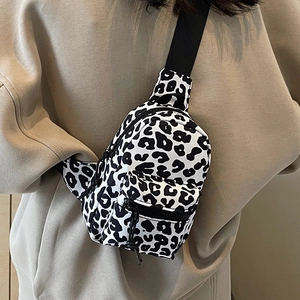Leopard print crossbody chest bag with adjustable strap and front zipper pocket