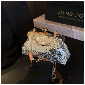 Detail of silver sequin evening bag with gold metal frame and double bead clasp