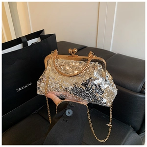 Detail of sequin evening clutch with gold metal frame and vintage kiss-lock closure