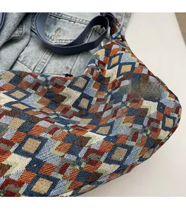 Close-up of bohemian canvas tote bag showing colorful geometric diamond jacquard texture