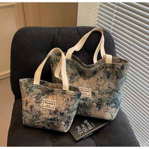 Close-up of vintage floral jacquard canvas tote bags with thick cotton webbing straps