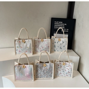 Floral canvas tote bags with lace overlay, cotton rope handles and wooden buttons