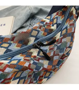 Detail view of the durable dual-zipper closure on a colorful woven bohemian tote bag