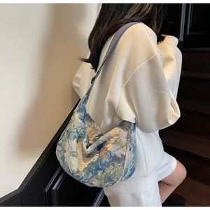 Detail of vintage oil painting style floral jacquard fabric on the hobo tote bag