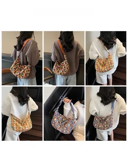 Detailed back view of large canvas tote bag featuring geometric patterns and wide strap