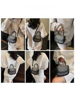 Multiple views of a gray polka dot baguette bag with bow metal buckle and leather strap