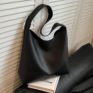 Minimalist black large capacity PU leather tote bag with a soft hobo silhouette design