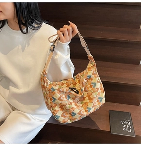 Detail of bohemian geometric knit canvas tote bag with adjustable shoulder strap