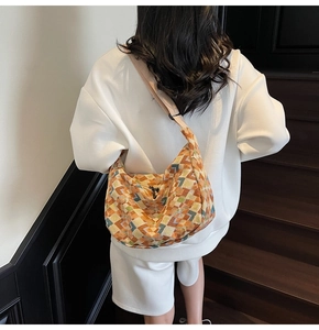 Detailed view of bohemian canvas tote bag with colorful geometric diamond pattern on back