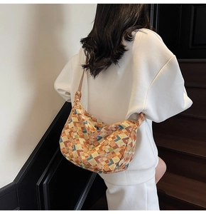 Close-up of bohemian hobo bag featuring a colorful geometric diamond pattern