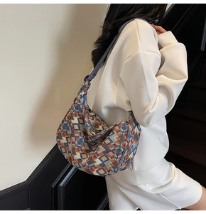 Detailed view of bohemian canvas tote with colorful geometric patterns and adjustable strap
