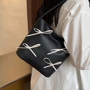 Minimalist black leather underarm bag with four white bow accents for women