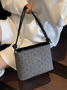 Polka dot canvas shoulder bag with metallic bow and knot handle in gray and black