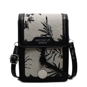 Fashionable black and white leaf print canvas crossbody bag with leather trim and strap
