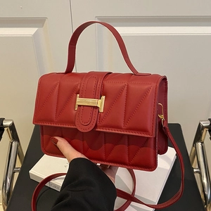 Red quilted leather tote bag with gold H clasp and shoulder strap for women