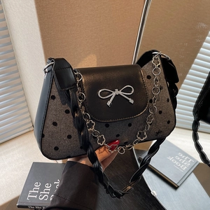 Vintage polka dot underarm bag with silver bow accent and floral chain strap