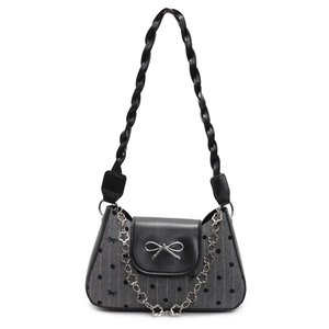 Chic gray polka dot shoulder bag with black leather flap and silver bow decoration