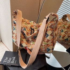 Bohemian woven tote bag with colorful geometric patterns and wide cotton shoulder strap
