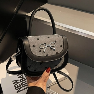 Polka dot grey tweed saddle bag with bow hardware and black leather trim for women
