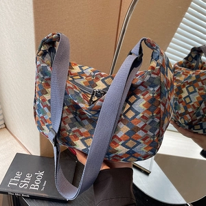 Bohemian geometric woven hobo shoulder bag with colorful pattern and wide strap