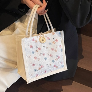 Beige floral lace canvas handbag with button closure and braided handles for women