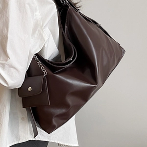 Minimalist large brown PU leather tote bag with mini coin purse shown on shoulder