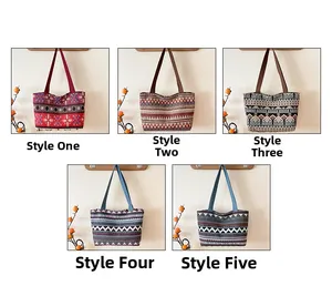 Detailed view of five canvas tote bags with ethnic geometric patterns and long shoulder straps