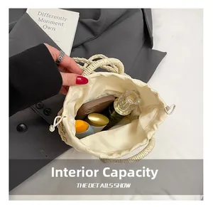Internal capacity of handmade woven cream bag showing daily essentials and drawstring lining