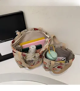 Internal view of floral canvas tote bags showing spacious storage for a tablet and umbrella