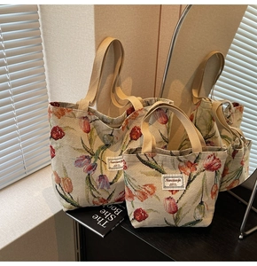 Detail of jacquard woven tote bags with tulip pattern and sturdy ribbon handles