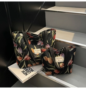 Detailed view of jacquard floral tote bags with tulip patterns on fabric texture