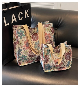 Detailed comparison of large and small ethnic floral tote bags in woven jacquard fabric