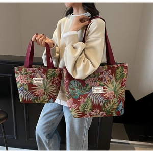 Detailed view of large and small jacquard tote bags with vintage floral patterns