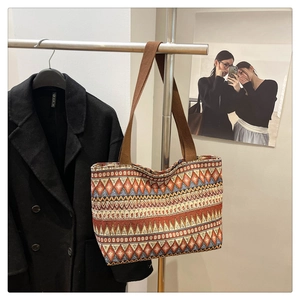 Detail of colorful geometric woven pattern on a large ethnic style tote bag