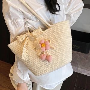 Handmade woven tote bag in cream white with lace bow and floral cherry pendants for summer