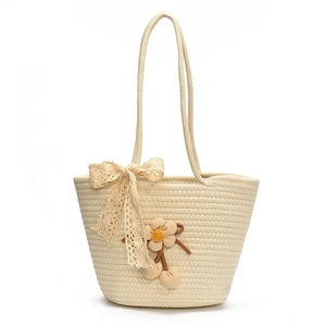 Handcrafted cream woven bucket bag with 3D floral accents and lace bow detail