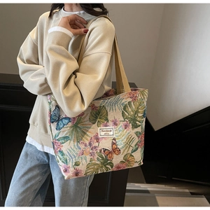 Detail of bohemian jacquard tote bag with butterfly embroidery and canvas straps