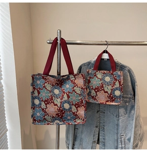 Detail of ethnic floral jacquard canvas tote bags in large and small sizes