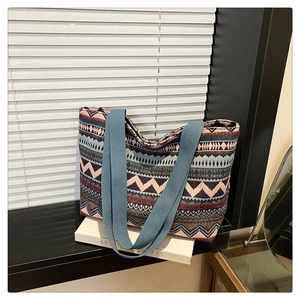 Detailed close-up of ethnic geometric pattern tote bag on artistic interior background