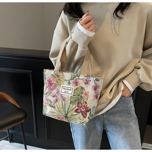 Detail of vintage floral tapestry tote bag featuring high-quality jacquard fabric textures