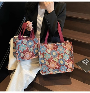 Detailed comparison of two sizes of ethnic jacquard tote bags with floral knit patterns