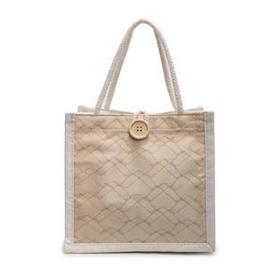 Borsa da pranzo quadrata minimalista con ricamo dorato e grande bottone in legno